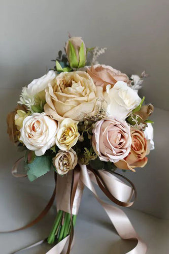 Hand Holding Champagne Flower Bridal Bouquet