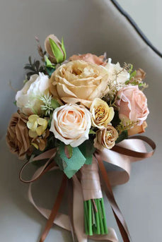 Hand Holding Champagne Flower Bridal Bouquet