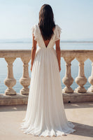 Load image into Gallery viewer, Ivory Ruffled V-Neck Ruched A Line Sweep Train Beach Wedding Dress with Slit
